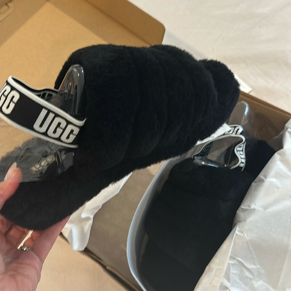 Never worn, new in box, women’s black UGG slippers, size 9
